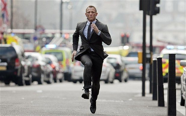 Man wearing a dark suit in a formal setting