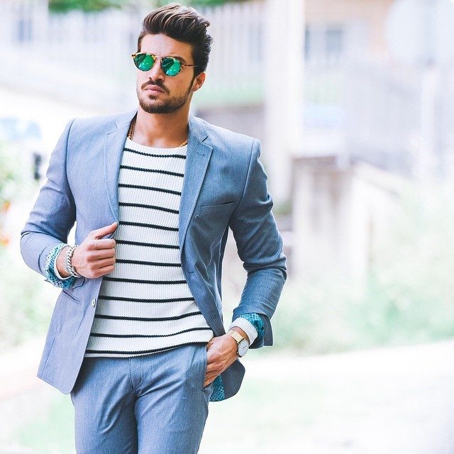Man wearing a fitted blue suit