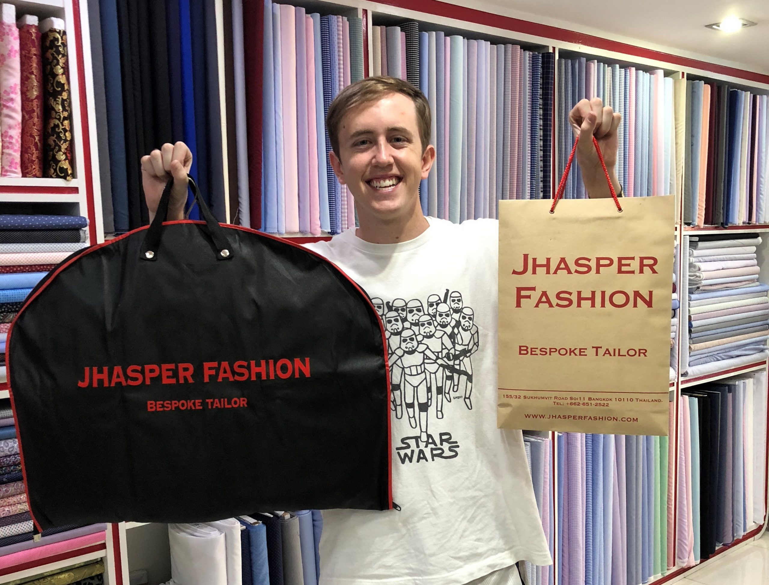 Happy client collecting his custom suit from Jhasper Fashion, bespoke tailor in Bangkok